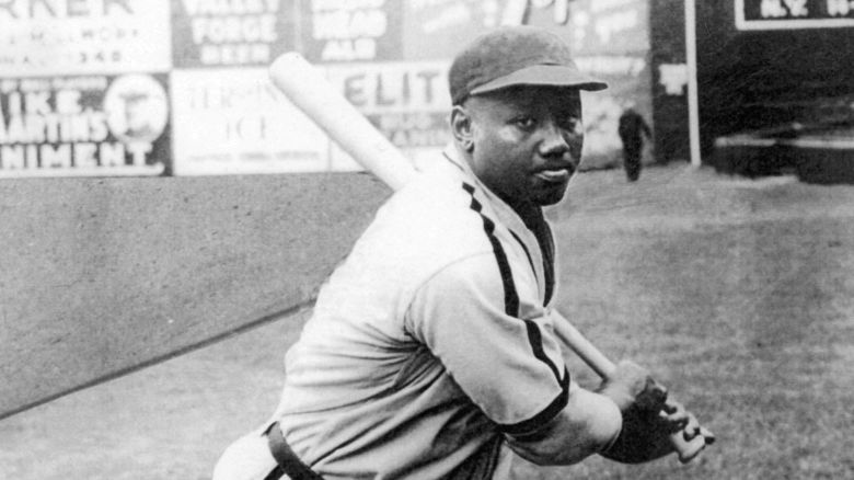 Josh Gibson, catcher for the Negro League Homestead Grays of Pittsburgh, practices his swing before a game at Forbes Field in 1940.
