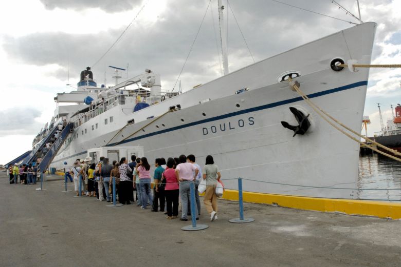 Visitors line up to enter the ship, then a missionary vessel known as MV Doulos, in the Philippines in 2007.