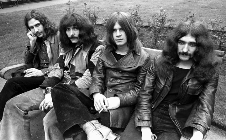 Osbourne, third from left, and other members of Black Sabbath — Bill Ward, Tony Iommi and Geezer Butler — sit on a bench together in 1970. The band’s first two albums, “Black Sabbath” and “Paranoid,” were released that year. “Paranoid” is often regarded as one of the greatest albums of all time, with notable songs including “Iron Man,” “War Pigs” and the title track.