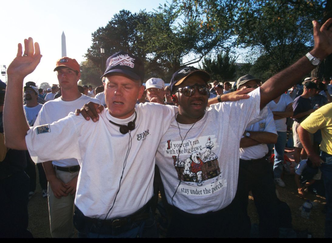 Members of the Promise Keepers pray on October 4, 1997, on the National Mall in Washington, DC. The gathering of several hundred thousand Christian men became one of the biggest religious events in United States history.