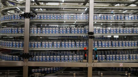 A picture taken on July 3, 2017 in Meautis shows the production line of a plant of French agricultural cooperative in the dairy industry "Les Maitres laitiers du Cotentin". 
The plant manufactures dairy products destinated to China's market. / AFP PHOTO / CHARLY TRIBALLEAU        (Photo credit should read CHARLY TRIBALLEAU/AFP via Getty Images)