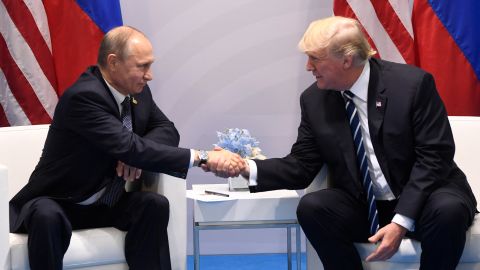 US President Donald Trump and Russia's President Vladimir Putin shake hands during a meeting on the sidelines of the G20 Summit in Hamburg, , on July 7, 2017. (Photo by SAUL LOEB / AFP) (Photo by SAUL LOEB/AFP via Getty Images)