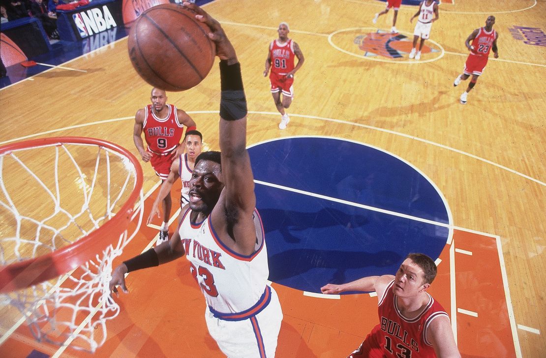 Patrick Ewing throws down a dunk for the Knicks during a game against the Chicago Bulls in 1996.