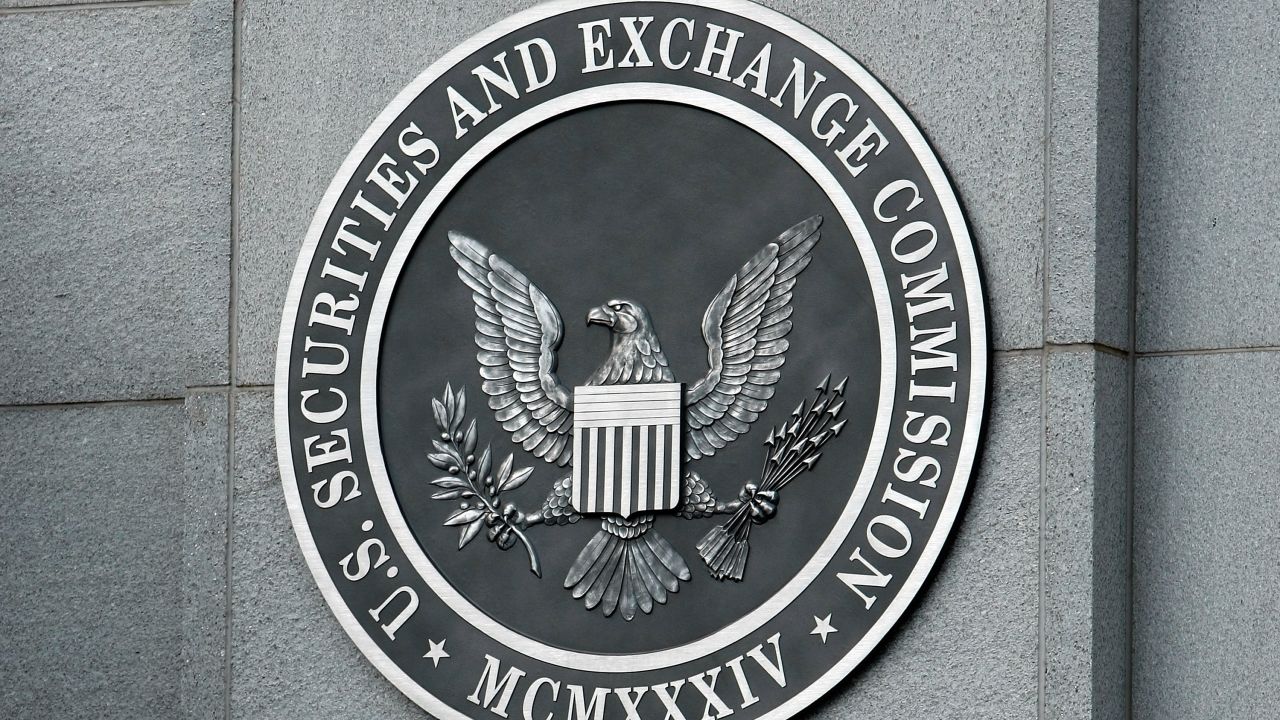 WASHINGTON - SEPTEMBER 18:  The U.S. Securities and Exchange Commission seal hangs on the facade of its building September 18, 2008 in Washington, DC. Republican presidential candidate Sen. John McCain (R-AZ) has called for the ouster of SEC Chairman Christopher Cox in the wake of the collapse of several giant banks on Wall Street and the resulting financial crisis.  (Photo by Chip Somodevilla/Getty Images)