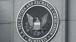 WASHINGTON - SEPTEMBER 18:  The U.S. Securities and Exchange Commission seal hangs on the facade of its building September 18, 2008 in Washington, DC. Republican presidential candidate Sen. John McCain (R-AZ) has called for the ouster of SEC Chairman Christopher Cox in the wake of the collapse of several giant banks on Wall Street and the resulting financial crisis.  (Photo by Chip Somodevilla/Getty Images)