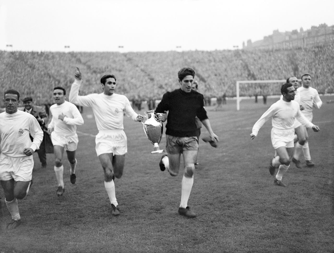 Real Madrid's Marquitos, center left, and Domínguez, center right, parade the original design of the European Cup around Hampden Park, Scotland, with their teammates after winning the trophy for the fifth successive year on May 18, 1960.