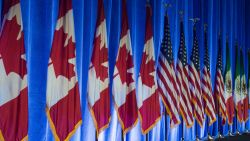 The flags of Canada, the United States, and Mexico, line the stage before the start of the negotiations for the modernization of NAFTA, August 16, 2016, in Washington, DC. Negotiators from Canada, Mexico and the United States opened the first round of talks Wednesday to revamp the 23-year-old regional free trade agreement some see as a demon and others as a savior. / AFP PHOTO / PAUL J. RICHARDS        (Photo credit should read PAUL J. RICHARDS/AFP via Getty Images)