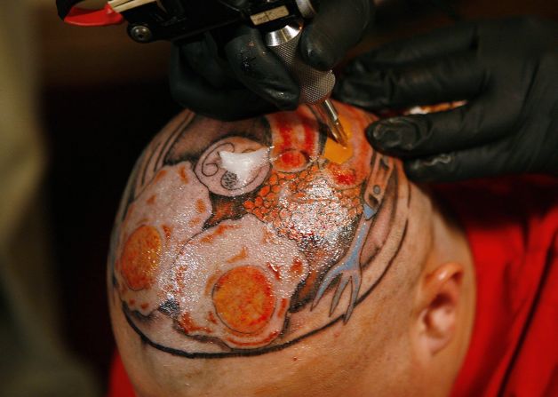 <strong>Breakfast on the brain: </strong>Some people really love a full English. Dayne Gilby, from the UK city of Coventry, had this tribute to the breakfast permanently tattoed on his head.