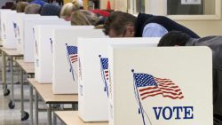 Voters cast their ballots on Election Day November 04, 2008, at Centreville High School in Clifton, Virginia. Americans crowded polling stations Tuesday to vote in their historic election, with front-running Democrat Barack Obama seeking to become the first black US president and Republican rival John McCain battling for a comeback.  AFP Photo/Paul J. Richards (Photo credit should read PAUL J. RICHARDS/AFP via Getty Images)