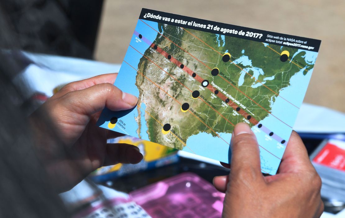 A woman views a map showing the eclipse path during the Solar Eclipse Festival at the California Science Center in Los Angeles, California, on August 19, 2017, two days before the total eclipse on August 21.