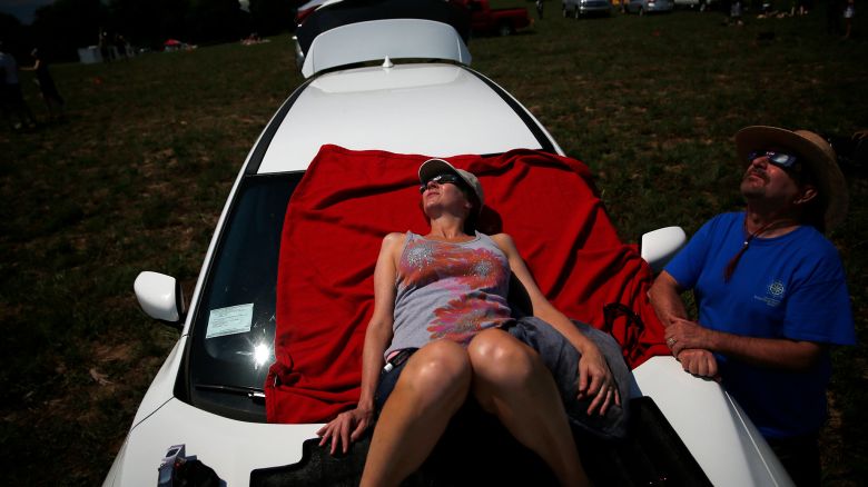 HOPKINSVILLE, KY - AUGUST 21: Lisa and Mark Nipper of Norman, Oklahoma watch as the total eclipse takes place in Hopkinsville, KY on Aug. 21, 2017. (Photo by Jessica Rinaldi/The Boston Globe via Getty Images)