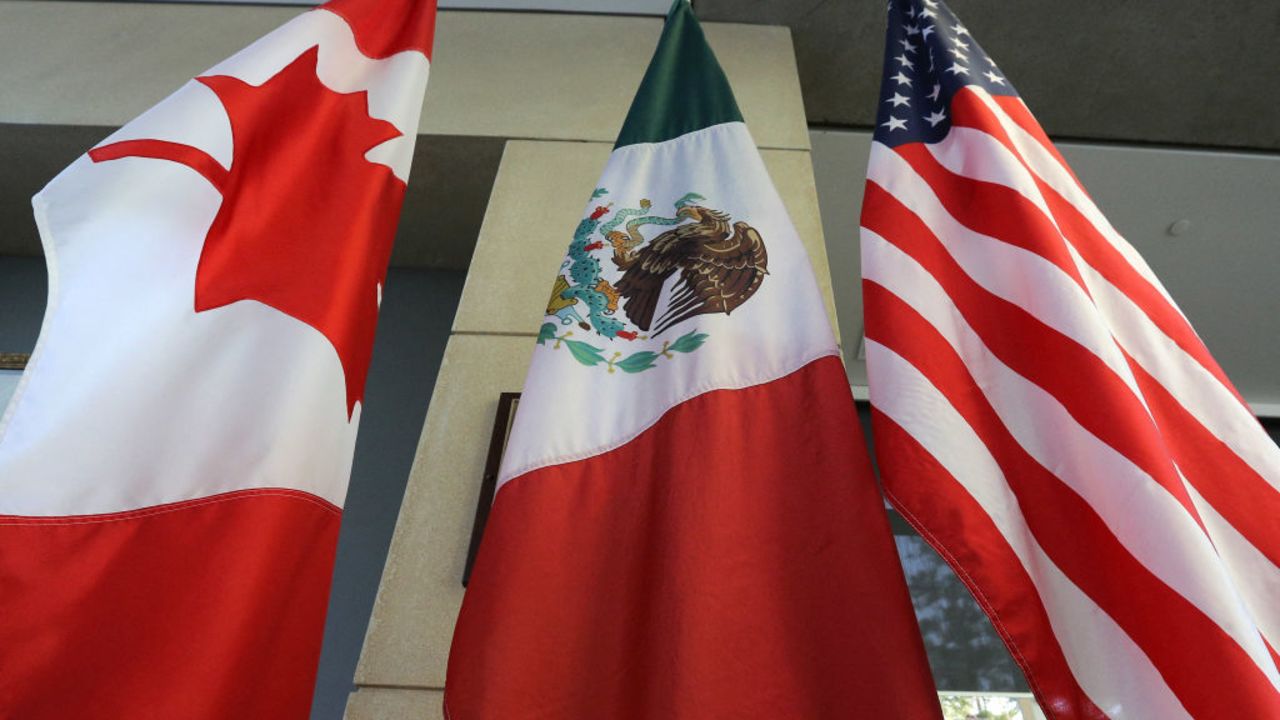 The Mexican, US and the Canadian flags sit in the lobby where the third round of the NAFTA renegotiations are taking place in Ottawa, Ontario, September 24, 2017. The negotiations will go between September 23-27, 2017 in Ottawa. (Photo by Lars Hagberg / AFP) (Photo by LARS HAGBERG/AFP via Getty Images)