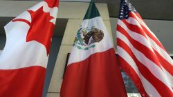 The Mexican, US and the Canadian flags sit in the lobby where the third round of the NAFTA renegotiations are taking place in Ottawa, Ontario, September 24, 2017. The negotiations will go between September 23-27, 2017 in Ottawa. (Photo by Lars Hagberg / AFP) (Photo by LARS HAGBERG/AFP via Getty Images)