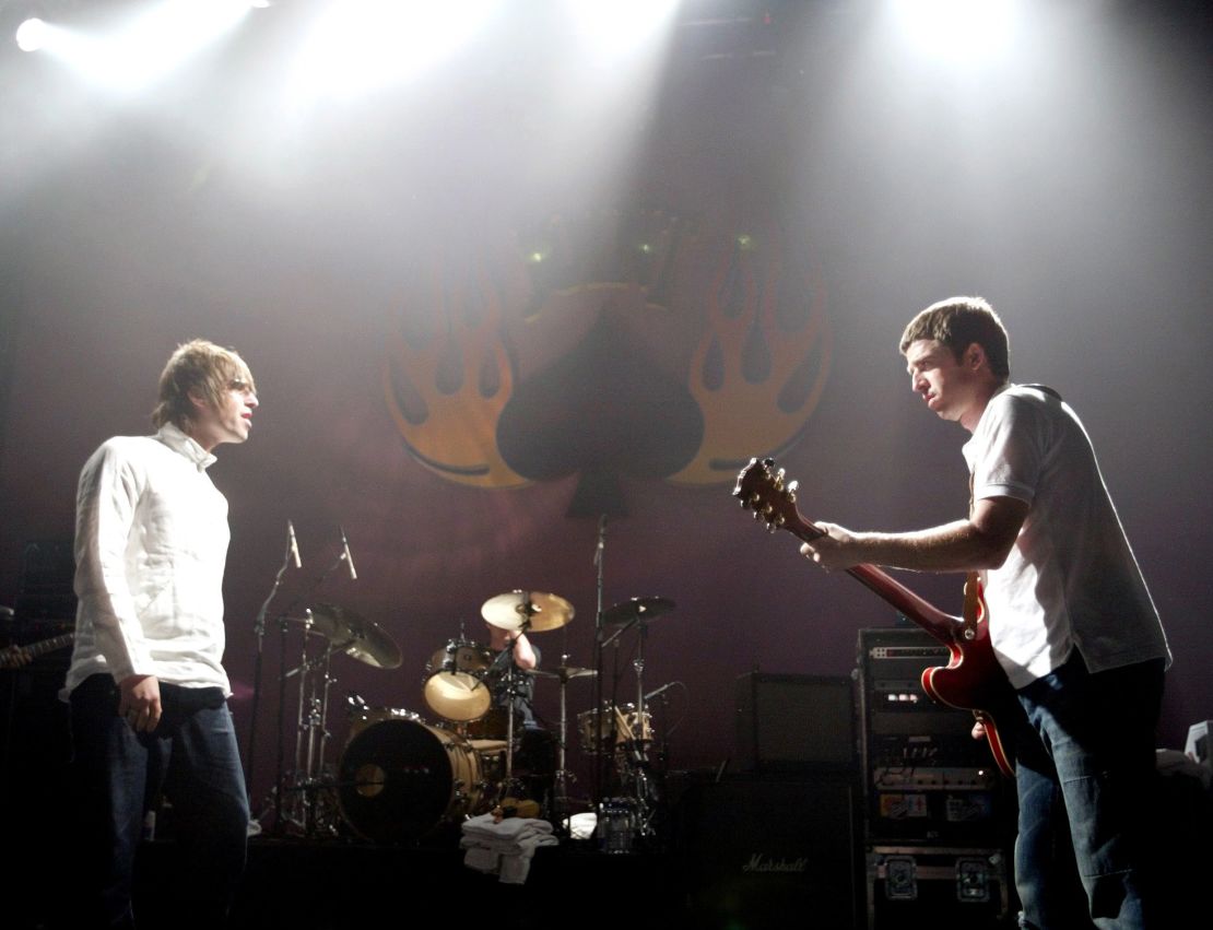 (From left) Liam Gallagher and Noel Gallagher of Oasis performing in Las Vegas in 2002.