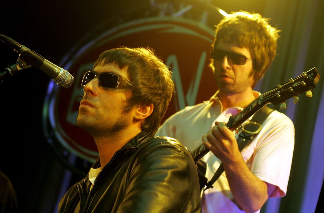 Liam Gallagher (left) and Noel Gallagher (right) during a live performance in the Netherlands in June 2001.