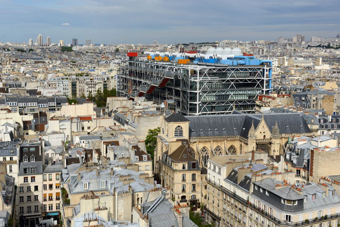 The modernist inside-out design contrasts with the Haussmann architecture of the surrounding city.