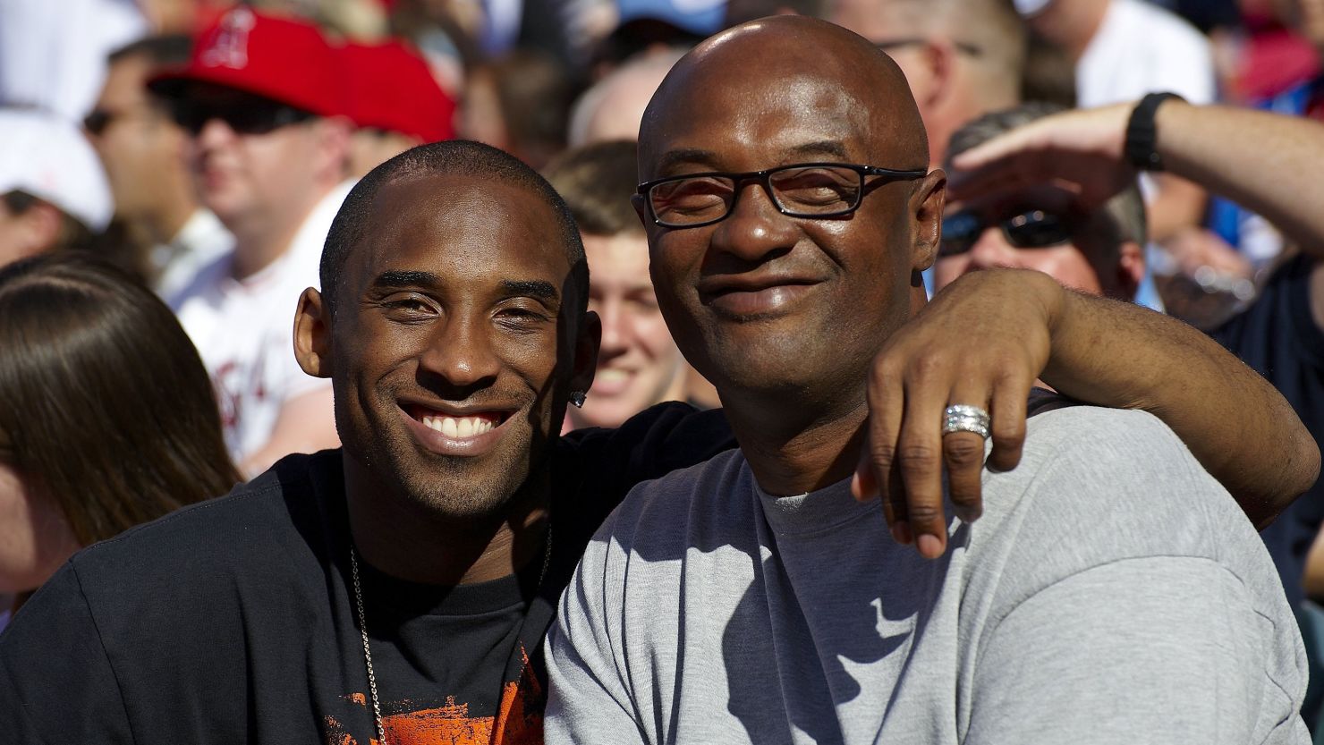 Kobe Bryant poses for a photo with his father, Joe Bryant, in 2009.