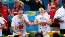 Joey Chestnut and Takeru Kobayashi stuff hot dogs into their mouths during Nathan's Famous Fourth of July hot dog eating contest in Coney Island in New York City, on July 4, 2009. Chestnut defeated Kobayashi with eating 68 to his 64.5 hotdogs.