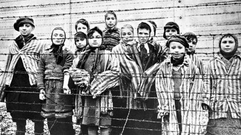Survivors of the Holocaust are pictured at the Nazi concentration camp at Auschwitz-Birkenau in southern Poland in January 1945.