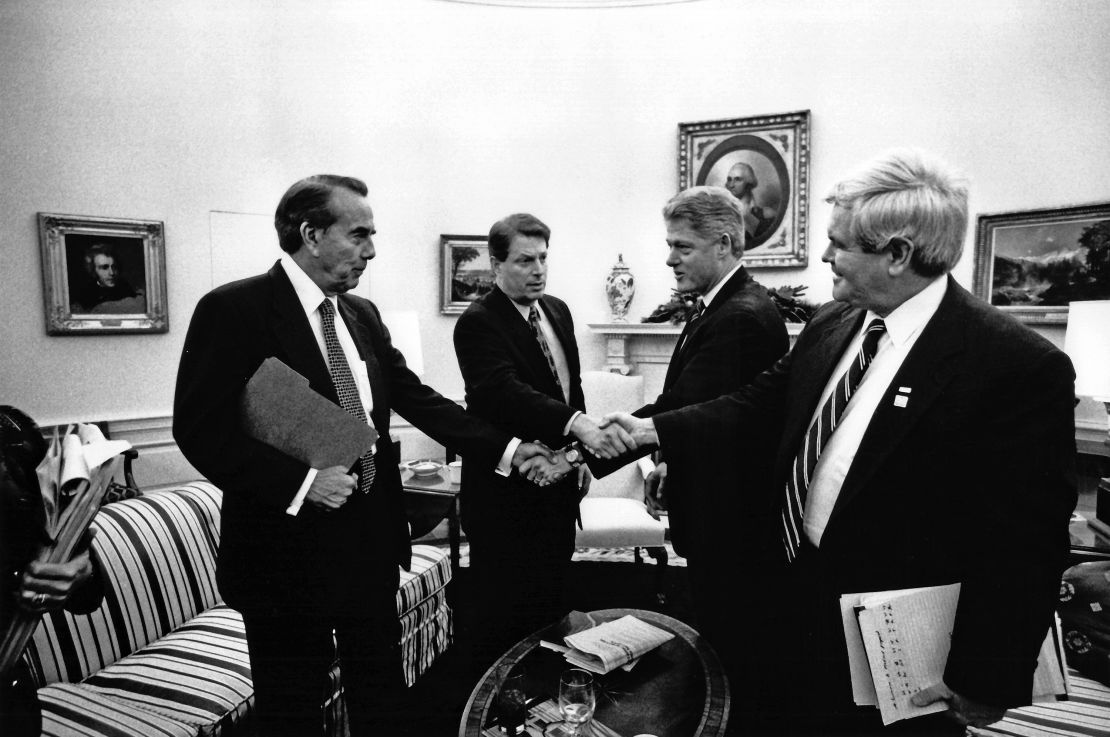 Senate Majority Leader Bob Dole, Vice President Al Gore, President Bill Clinton and Speaker of the House of Representatives Newt Gingrich shake hands in the Oval Office on December 19, 1995.