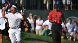 Y.E. Yang of South Korea after sinking his putt to win August 16 ,2009 at the 91st PGA Championship at the Hazeltine National Golf Club in Chaska, Minnesota.  At right is Tiger Woods of the US . AFP PHOTO / ROBYN BECK (Photo credit should read ROBYN BECK/AFP via Getty Images)