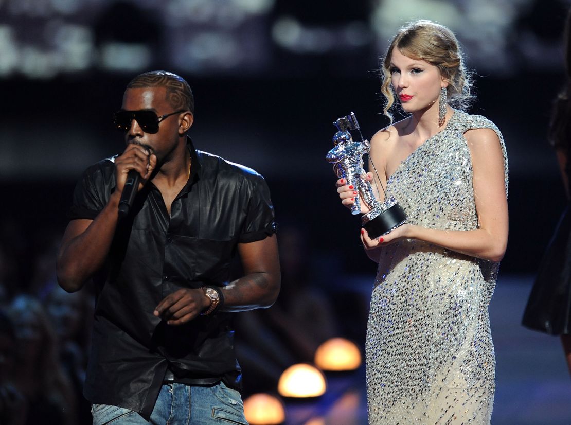 Kanye West takes the microphone from Taylor Swift and speaks onstage during the 2009 MTV Video Music Awards.