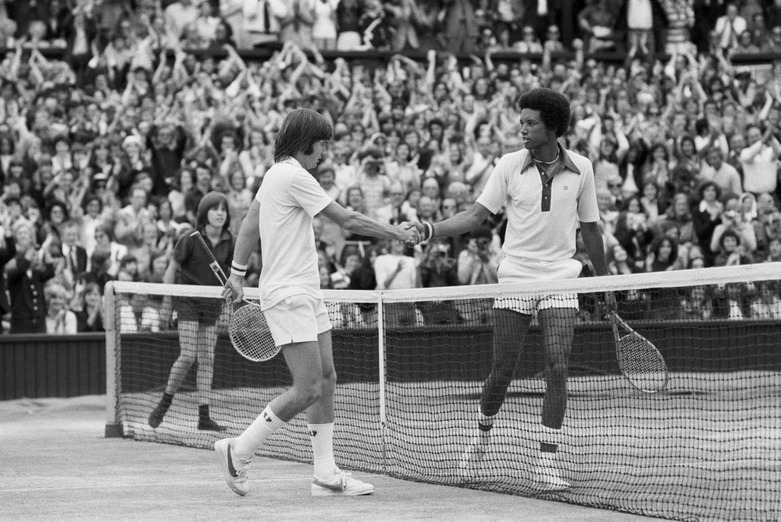 Ashe shakes hands with Jimmy Connors after the 1975 Wimbledon final.