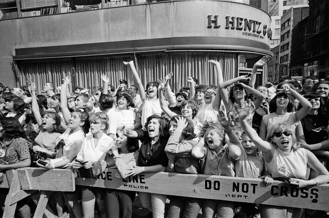 The Beatles in New York City, on their North American Tour ahead of their concert to be held at Forest Hills. Cheering fans gathered outside the Delmonico Hotel in New York where the band are staying, 28th August 1964.