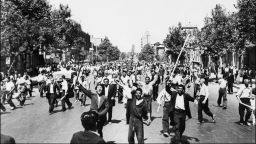 Pro-monarchy rioters take to the streets of Tehran in August 1953.