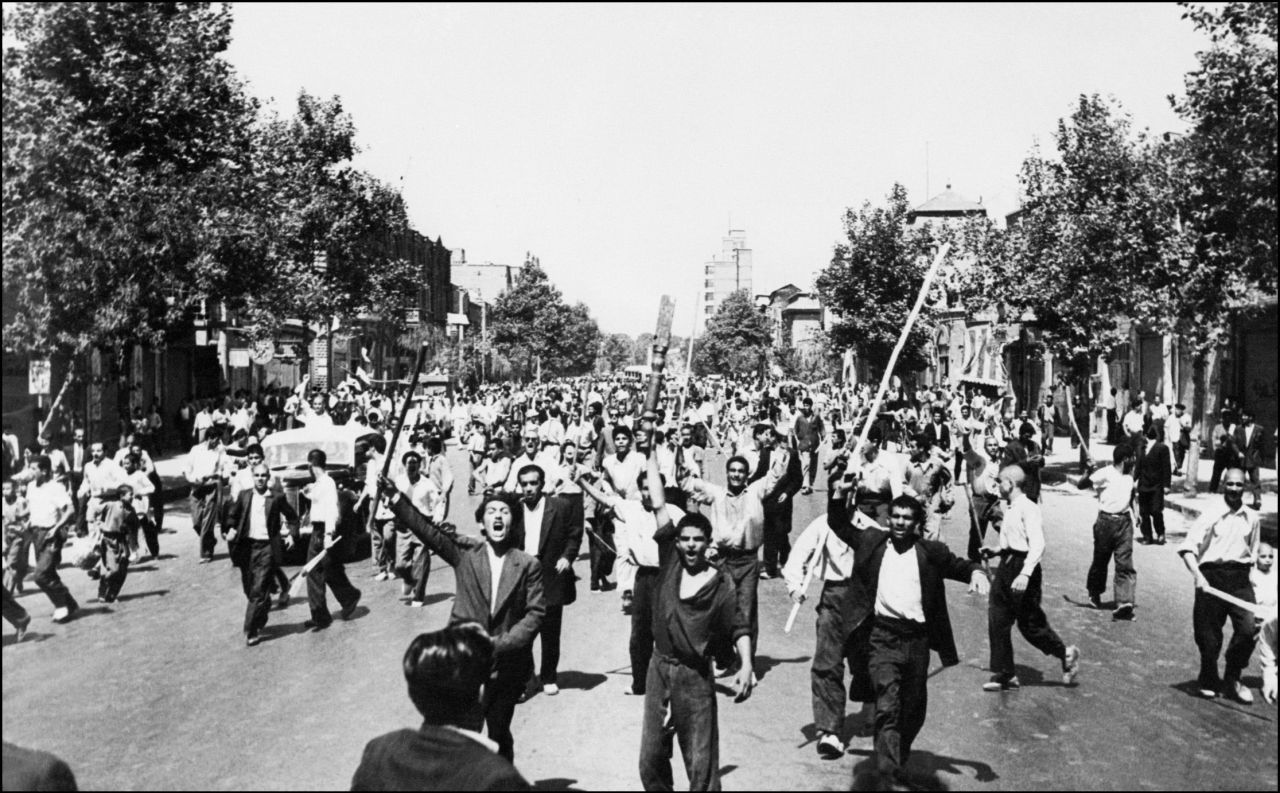 Pro-monarchy rioters take to the streets of Tehran in August 1953.