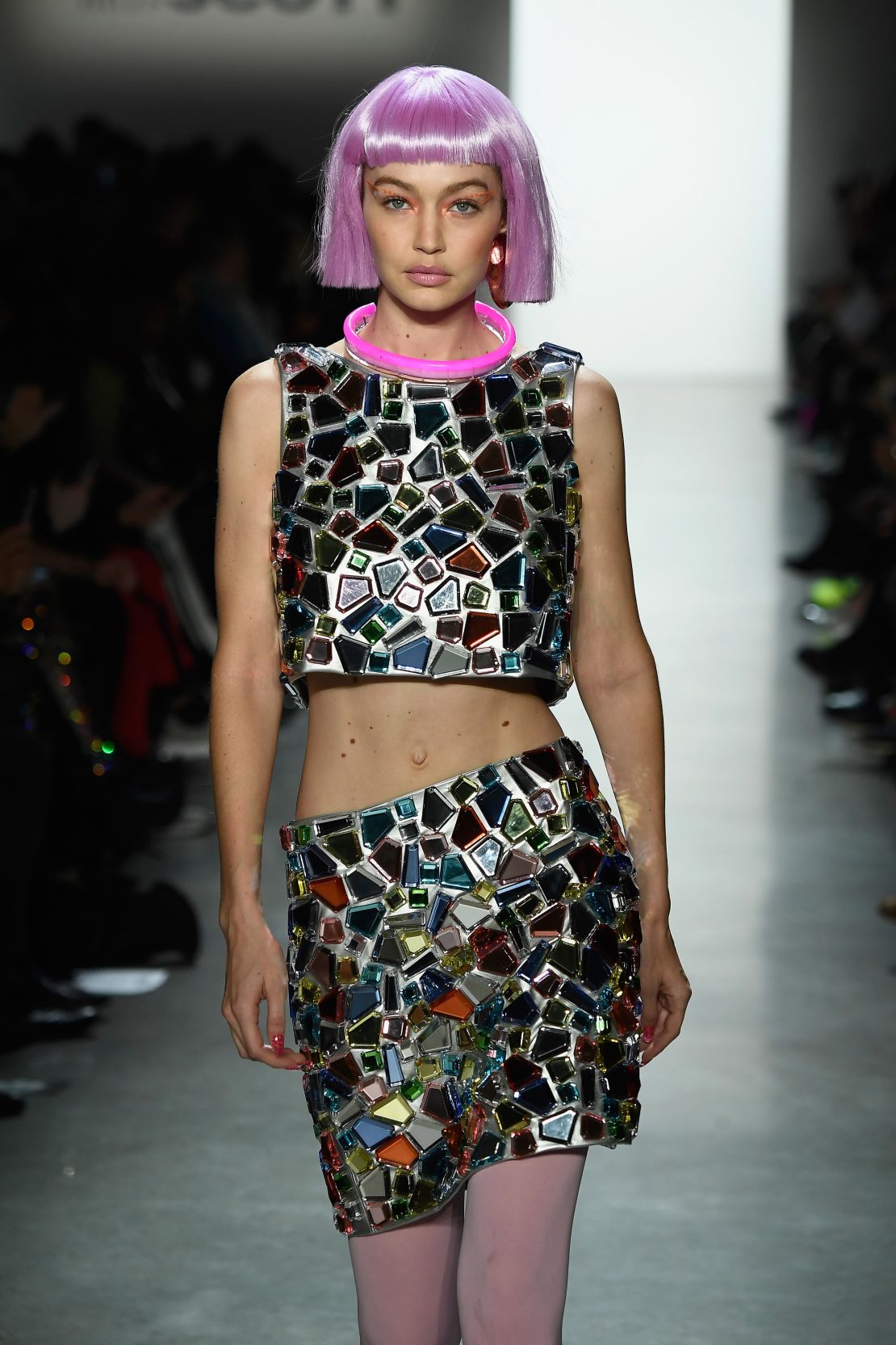 Gigi Hadid walked the runway for Jeremy Scott during New York Fashion Week in 2018 wearing a choppy pink synthetic wig.
