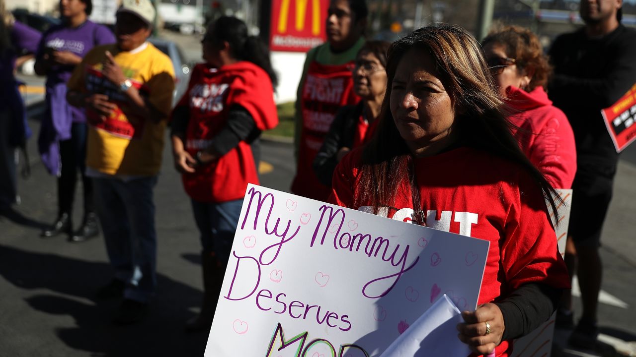 OAKLAND, CA - FEBRUARY 12:  Fast food workers and union members carry signs as they stage a protest outside of a McDonald's restaurant on February 12, 2018 in Oakland, California. Dozens of fast food workers staged a protest outside of a McDonald's restaurant to demand a $15 an hour minimum wage on the 50th anniversary of the historic Memphis Sanitation Strike that was led by Dr. Martin Luther King Jr.  (Photo by Justin Sullivan/Getty Images)