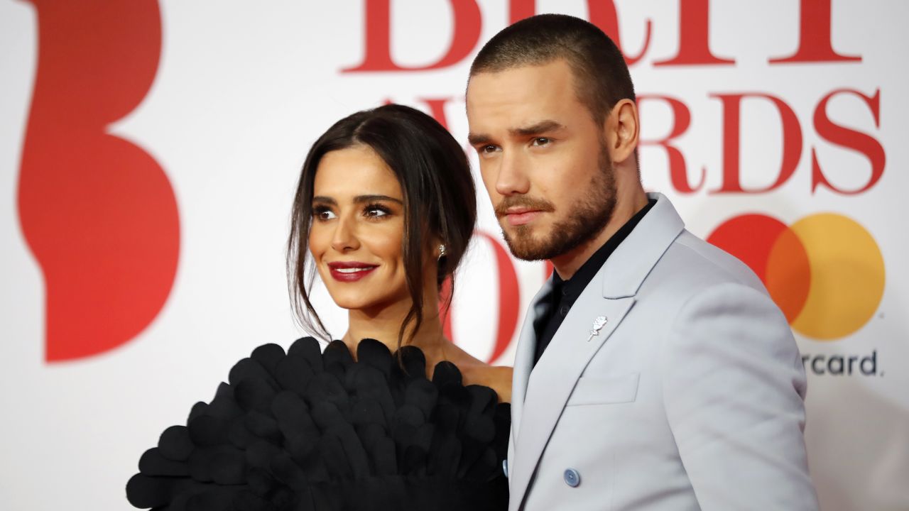 British singer-songwriter Liam Payne (R) and partner Cheryl pose on the red carpet on arrival for the BRIT Awards 2018 in London on February 21, 2018.