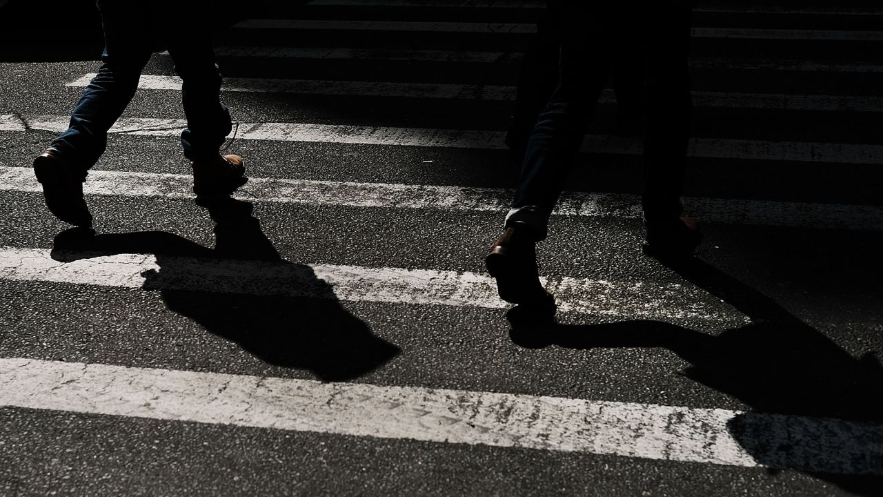 Pedestrians walk along a Manhattan street on March 6, 2018 in New York City.
