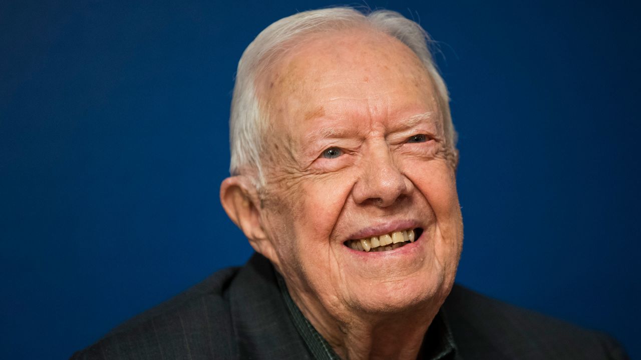 In this 2018 file photo, former US President Jimmy Carter smiles during a book signing event for his new book 'Faith: A Journey For All' at Barnes & Noble bookstore in New York.
