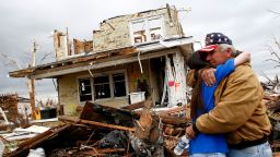 UNITED STATES - MAY 09:  Lonnie McCollum, right, mayor of Greensburg, is comforted by his daughter Shana Pittenger in front of his destroyed home in Greensburg, Kansas, Wednesday, May 9, 2007. An F5 tornado leveled 95 percent of Greensburg last Friday.  (Photo by Joshua Lott/Bloomberg via Getty Images)