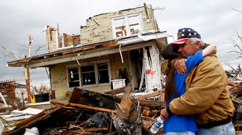 UNITED STATES - MAY 09:  Lonnie McCollum, right, mayor of Greensburg, is comforted by his daughter Shana Pittenger in front of his destroyed home in Greensburg, Kansas, Wednesday, May 9, 2007. An F5 tornado leveled 95 percent of Greensburg last Friday.  (Photo by Joshua Lott/Bloomberg via Getty Images)