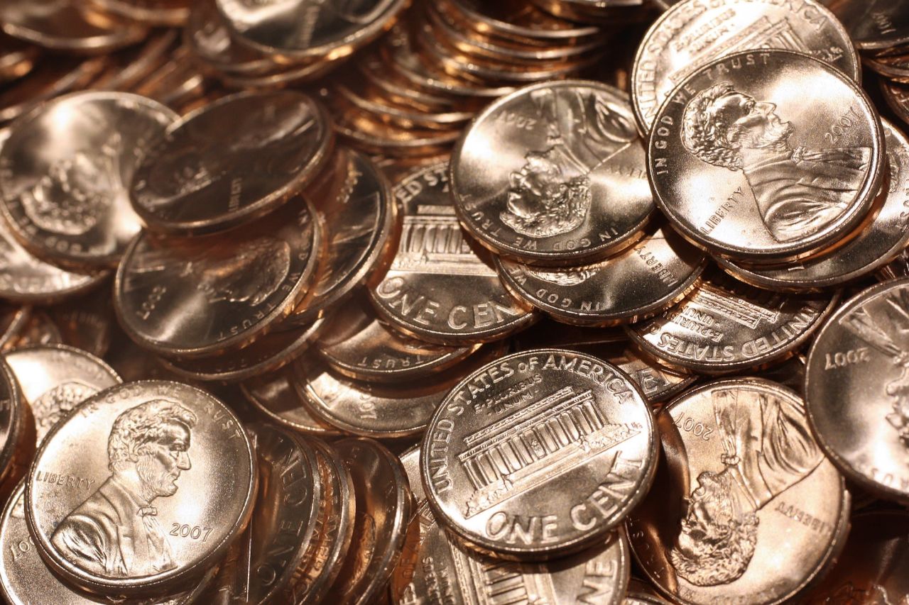 Recently struck pennies sit in a bin at the US Mint in Philadelphia on August 8, 2007.