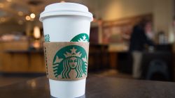 A Starbucks coffee cup is seen inside a Starbucks Coffee shop in Washington, DC, April 17, 2018, following the company's announcement that they will close more than 8,000 US stores on May 29 to conduct "racial-bias education" following the arrest of two black men in one of its cafes. (Photo by SAUL LOEB / AFP) (Photo by SAUL LOEB/AFP via Getty Images)