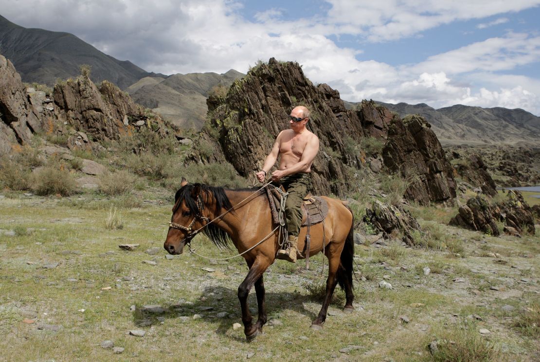 Vladimir Putin pictured riding a horse shirtless in August 2009.