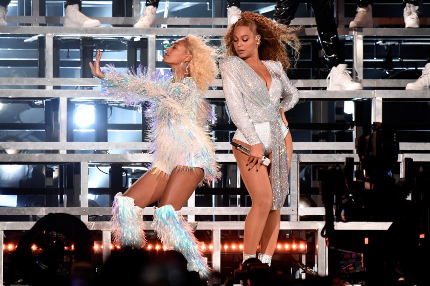 Solange (L) and Beyoncé perform onstage during the Coachella Valley Music and Arts Festival on April 21, 2018.