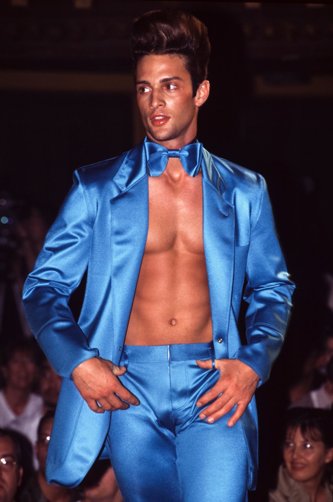 Jean-Paul Gaultier's "Pin Up Boys" from the 1996 season were early examples of the shirtless suit on the runway.