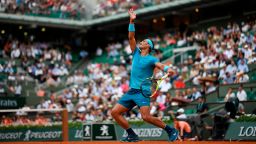 TOPSHOT - Spain's Rafael Nadal serves to Italy's Simone Bolelli during their men's singles first round match on day two of The Roland Garros 2018 French Open tennis tournament in Paris on May 28, 2018. (Photo by CHRISTOPHE SIMON / AFP)        (Photo credit should read CHRISTOPHE SIMON/AFP via Getty Images)