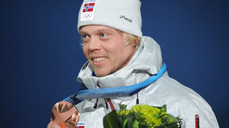 Norway's bronze winner Audun Groenvold celebrates on the podium during the medal ceremony of the men's freestyle ski cross final of the Vancouver Winter Olympics, on February 21, 2010.    AFP PHOTO / MARTIN BUREAU (Photo credit should read MARTIN BUREAU/AFP via Getty Images)
