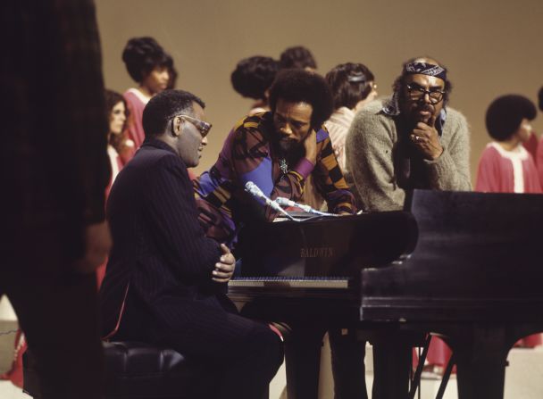 Ray Charles confers with Jones on stage during the "Duke Ellington...We Love You Madly" tribute show in 1973.