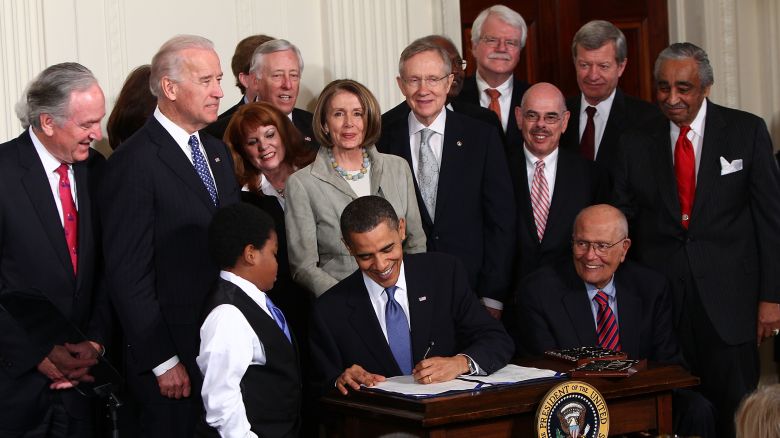 President Barack Obama signs the Affordable Health Care for America Act during a ceremony with fellow Democrats in the East Room of the White House on March 23, 2010 in Washington, DC.