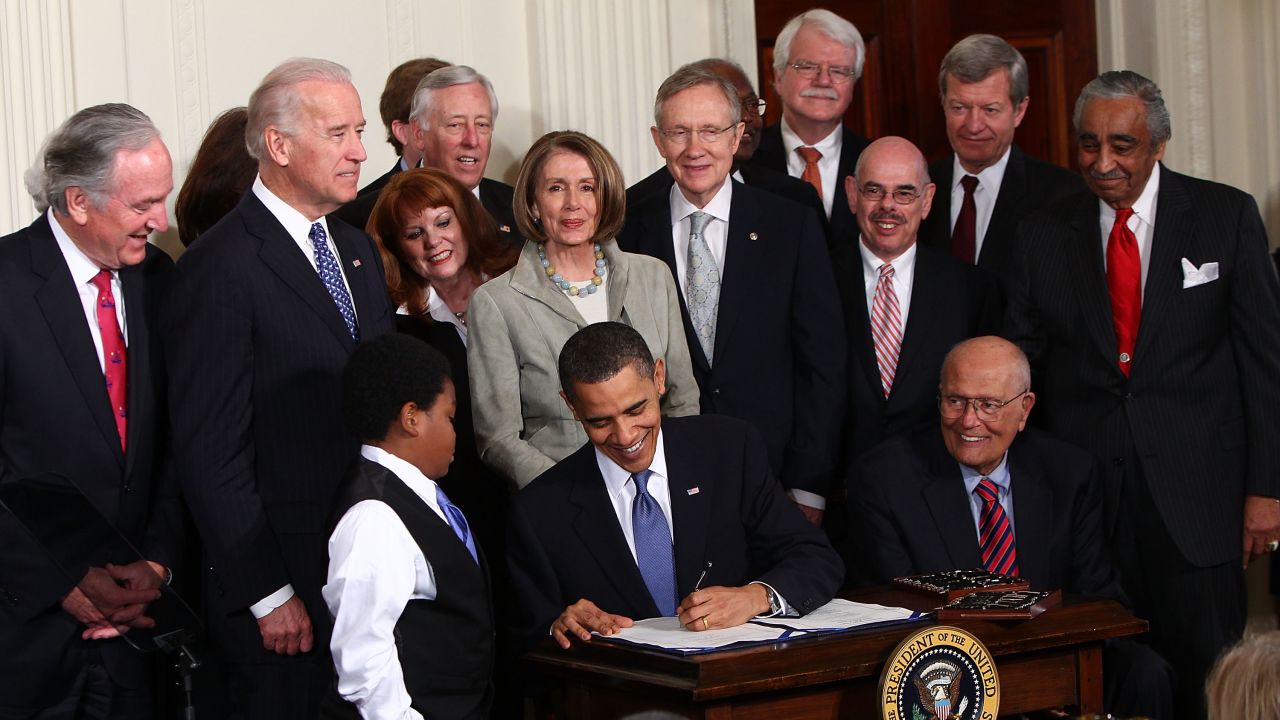 President Barack Obama signs the Affordable Health Care for America Act during a ceremony with fellow Democrats in the East Room of the White House on March 23, 2010 in Washington, DC.