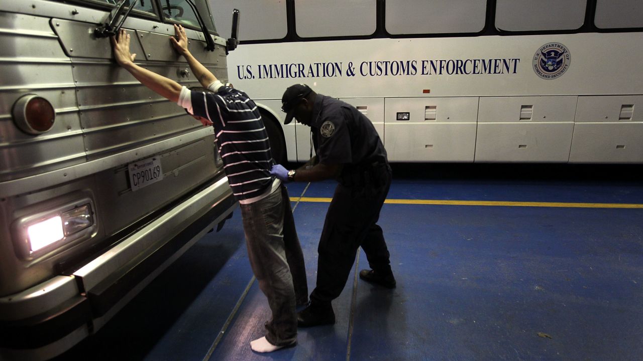 PHOENIX - APRIL 28:  An undocumented Mexican immigrant is searched while being in-processed at the Immigration and Customs Enforcement (ICE), center on April 28, 2010 in Phoenix, Arizona. Across Arizona, city police and county sheriffs' departments turn over detained immigrants to ICE, which deports them to their home countries. Last year the federal agency deported some 81,000 illegal immigrants from the state of Arizona alone, and with the passage of the state's new tough immigration enforcement law, the number of deportations could rise significantly.  (Photo by John Moore/Getty Images)