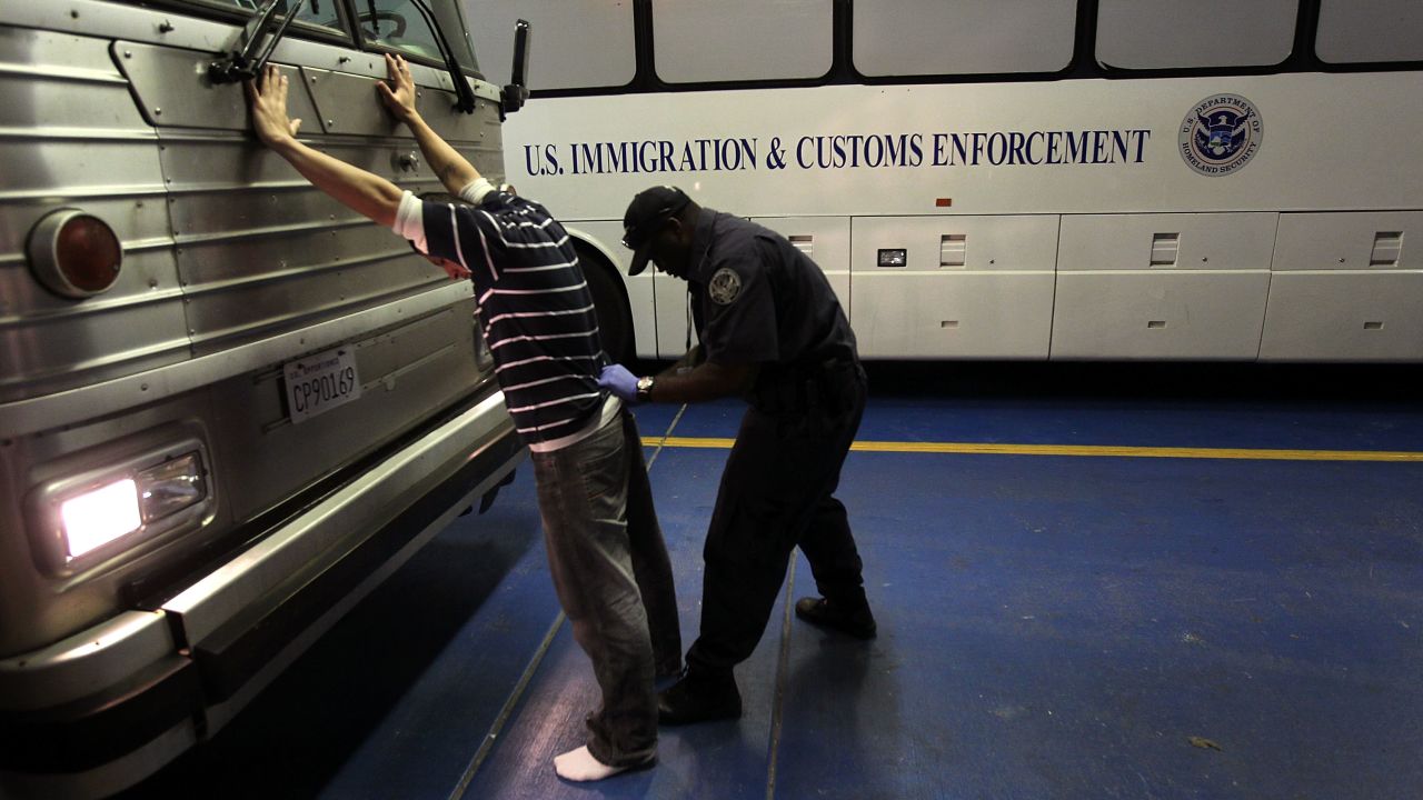 PHOENIX - APRIL 28: An undocumented Mexican immigrant is searched while being in-processed at the Immigration and Customs Enforcement (ICE), center on April 28, 2010 in Phoenix, Arizona. Across Arizona, city police and county sheriffs' departments turn over detained immigrants to ICE, which deports them to their home countries. Last year the federal agency deported some 81,000 illegal immigrants from the state of Arizona alone, and with the passage of the state's new tough immigration enforcement law, the number of deportations could rise significantly. (Photo by John Moore/Getty Images)