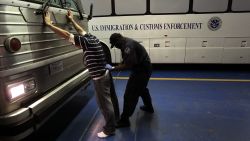 PHOENIX - APRIL 28:  An undocumented Mexican immigrant is searched while being in-processed at the Immigration and Customs Enforcement (ICE), center on April 28, 2010 in Phoenix, Arizona. Across Arizona, city police and county sheriffs' departments turn over detained immigrants to ICE, which deports them to their home countries. Last year the federal agency deported some 81,000 illegal immigrants from the state of Arizona alone, and with the passage of the state's new tough immigration enforcement law, the number of deportations could rise significantly.  (Photo by John Moore/Getty Images)